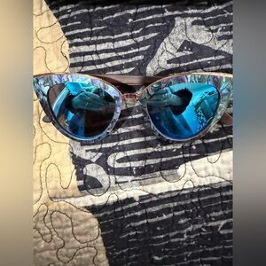 Slyk Bombshell cat-eye sunglasses featuring a wood frame and abalone shell